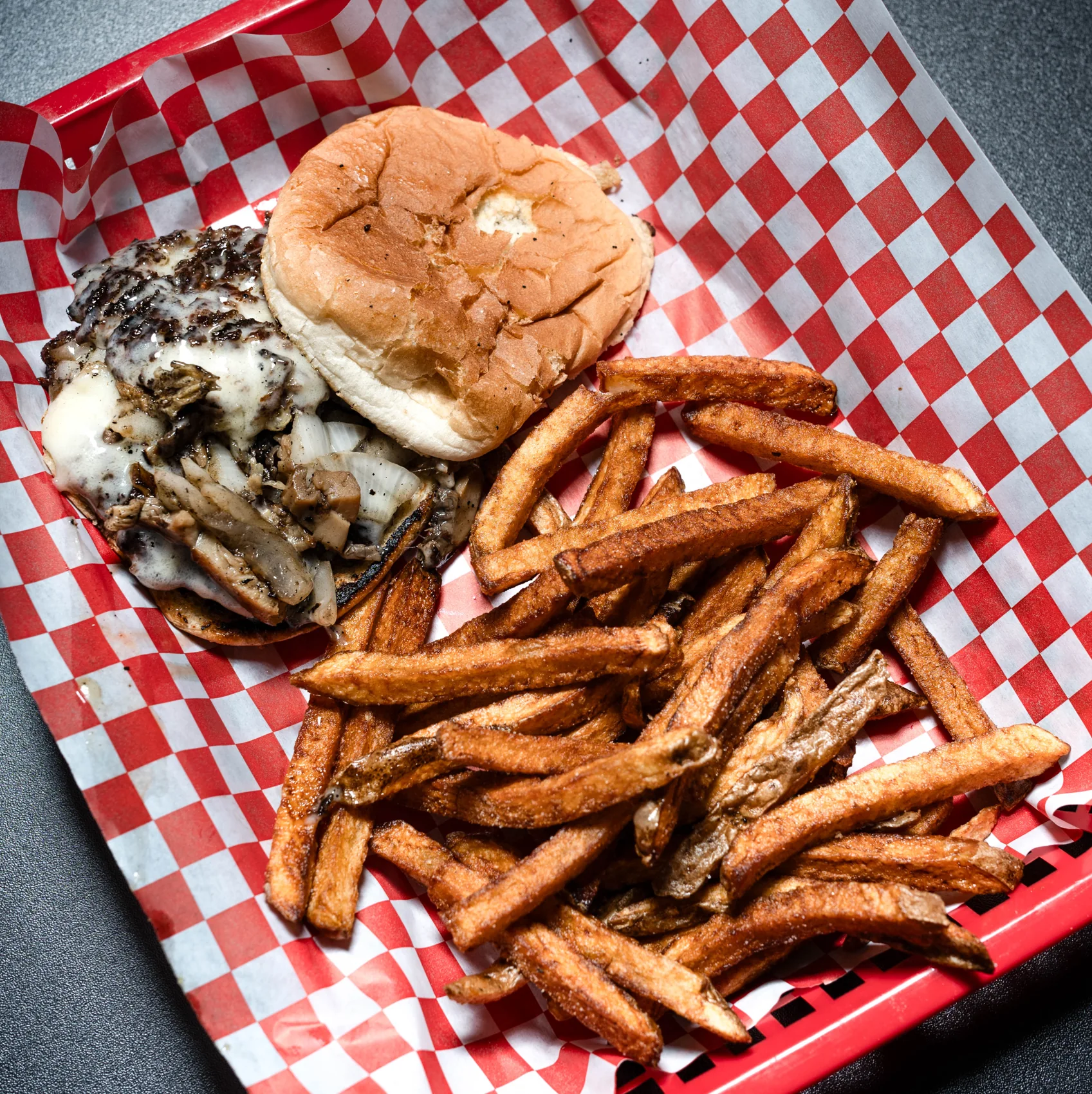 Backstreet burger with fries in a red basket