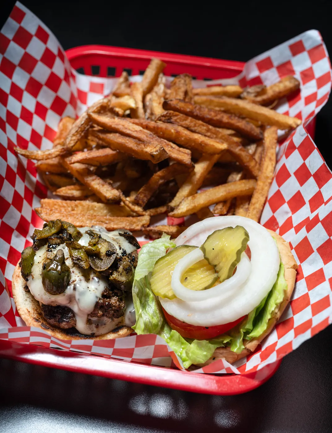 Backstreet burger and fries with fresh toppings on the side